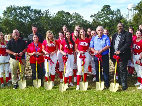 The sun was shining brightly on the golden shovels at the ceremonial groundbreaking ceremony for the Basile High Lady Cat softball field.  Pictured with shovels are (from left to right) are Kevin Bertrand, Basile High athletic director; Helana Francois, Basile High principal; Alli Chaumont, Hanna Manuel, and Henley LeJeune, Lady Cat softball team captains; Wayne Dardeau, EPSB president; and Darwan Lazard, EPSB superintendent. 
