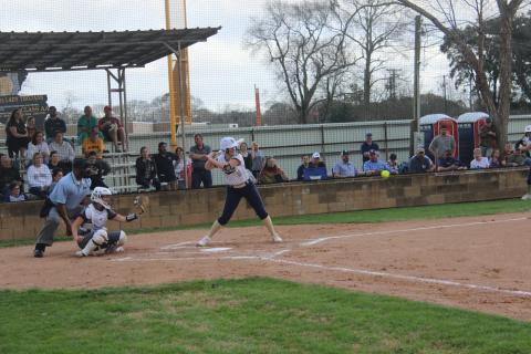 Lady Trojans’ slugger Jolie Vidrine stands ready at the plate in an early season softball game. (Gazette photo by Rhett Manuel)
