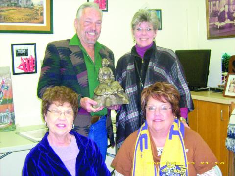 In the left photo, holding the bronze Maquette of Our Evangeline is Sculptor Jerry Gorum, back row, left. Also pictured next to him is Suzy Lemoine, project chair; and in front, left to right, are Mary Alice Fontenot, tourism president; and Camille Fontenot, tourism director. 