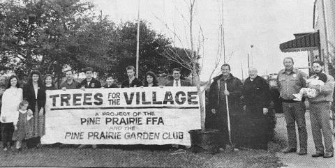 Shown, from left, are Village Clerk Danette Cloud, Erin Saunders, Pine Prairie Garden Club President Sheila Saunders, Pine Prairie Garden Club member Ruthie Evans, FFA advisor Kerry Saucier, FFA treasuer Billy James Johnson, FFA secretary Tav Leggett, FFA president Shane Barrett, FFA vice president Nikki Ardoin, state representative Dirk Deville, Pine Prairie Mayor Terrel McCauley, Father Leslie Prescott, Police Chief L.C. Deshotel and Weley and William Saunders.