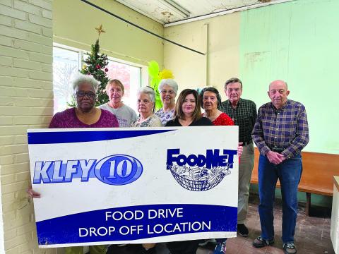 CARE AND SHARE TO PARTICIPATE IN FOOD DRIVE - Shown, from left, are volunteers Gloria Griffin, Anetta Fontenot, Becky Miller, Sharlene Znamierowski, Kaera Doucet, Ollie Bright, Eugene Fontenot, and P.L. Fontenot. (Gazette photo by Heather Bogard)