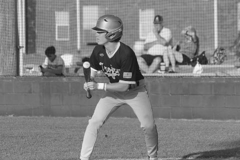 Trojan leadoff hitter and starting shortstop Gabe Wilmouth (11) attempts to lay down a bunt in Thursday’s loss to Kinder. (Gazette photo by Rhett Manuel)