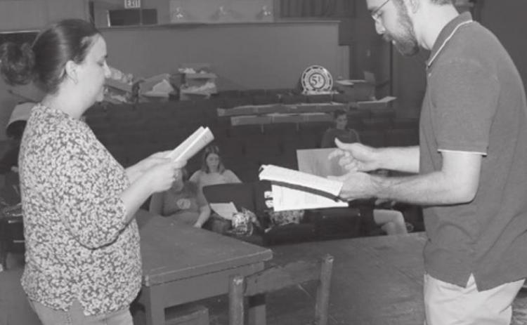 Kristi Burleigh, left, and Nathaniel Clark rehearse lines from “Aboveboard,” a play schedule to be staged in June at the Eunice Players’ Theatre. The production is the first for the Eunice Players’ since the theater was shutdown by COVID-19. (LSN photo by Harlan Kirgan)