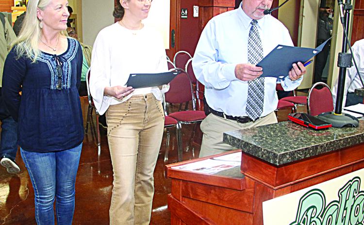St. Landry Parish President Jessie Bellard, right, reads a proclamation declaring Dewey Balfa Cajun & Creole Heritage Week for March 24 to 25 at Lakeview Park and Beach. Also shown, from left, are Jeanne Solis, executive director for Louisiana Folk Roots, and Board member Colby Martin at the Wednesday, February 5, St. Landry Parish Council meeting. (LSN photo by Harlan Kirgan)