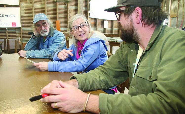Jeanne Solis, Folk Roots executive director, center, explores questions about culture with from left, Pete Hobbie, of West Virginia, and Jo Vidrine, program and artistic director of Dewey Balfa Cajun and Creole Heritage Week at Lakeview Park & Beach, north of Eunice off La. 13. (LSN photo by Harlan Kirgan)