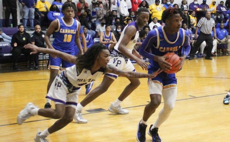 Davontae Fontenot (0) attempts to steal away the basketball in the Bulldogs’ game against Carroll. (Photo courtesy of VPHS)