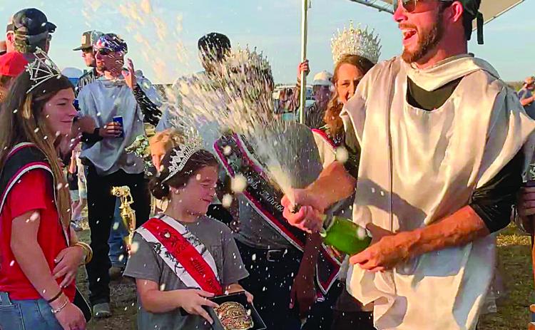 Tournoi Champion John Ross Guillory celebrates his victory with a celebratory champagne shower. For more scenes from this year’s running of the event, turn to Page 12. (Photo by Elizabeth West)
