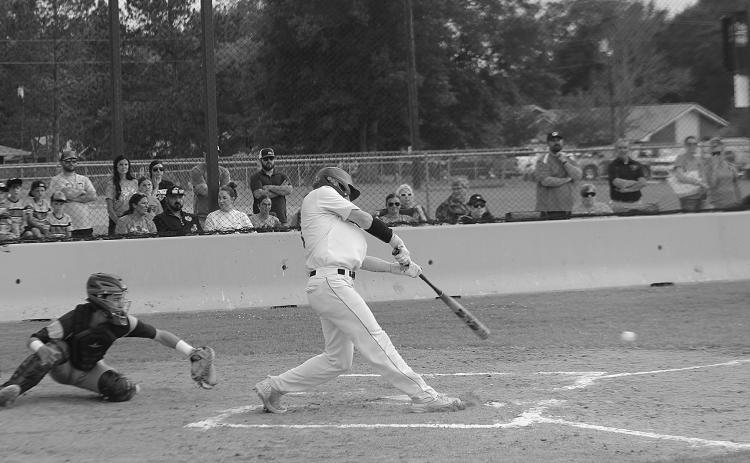 Caden Askey (7) connects with a pitch in a game against Church Point during a best-of-three playoff series held at Pine Prairie. The Panthers now play a best-of-three series at Red River in the second round. (Gazette photo by Rhett Manuel)