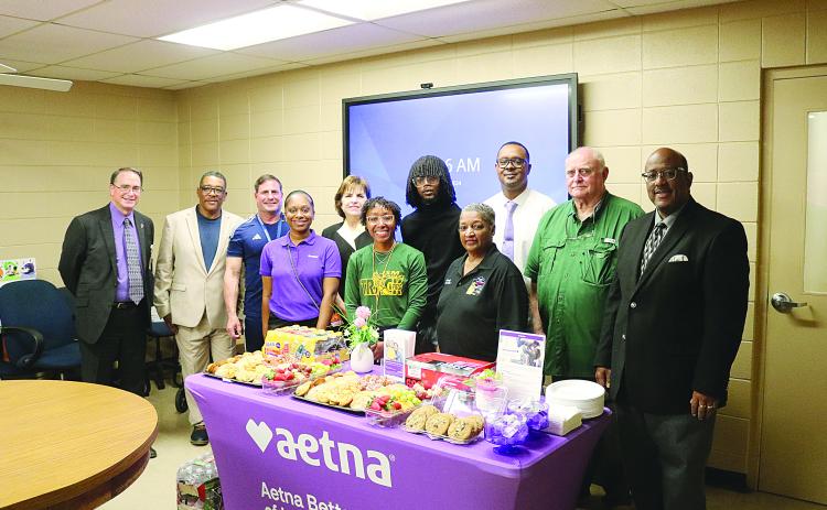 From left are (back row) Assistant Superintendent Mike Lombas, Roy Serie, Eric Fontenot, Ann Kay Logarbo, Torren LaFleur, Tommy Jones, School Board President Bobby Hamlin, and Superintendent Darwan Lazard; (front row) Amber McCoy, Maegan Moore, and School Board Vice President Sheila Joseph. (Gazette photo by Tony Marks)