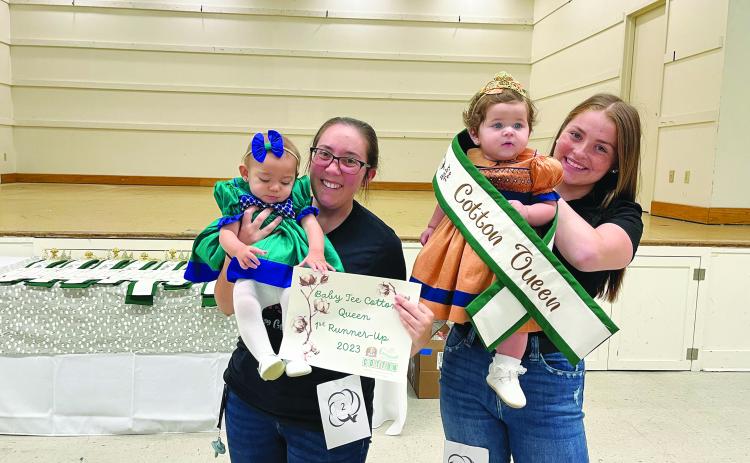 BABY TEE COTTON QUEEN - Shown, from left, are first runner-up Genesis Bothwell and Queen Olivia Sage Briscoe.