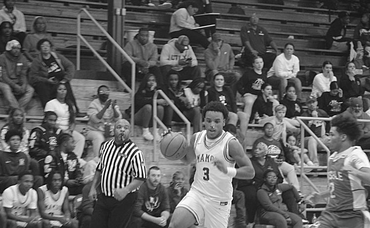 Mamou’s Zamaurri Brown (3) drives toward the goal in a game against Basile during the parish basketball tournament at Sacred Heart. (Gazette photo by Tony Marks)