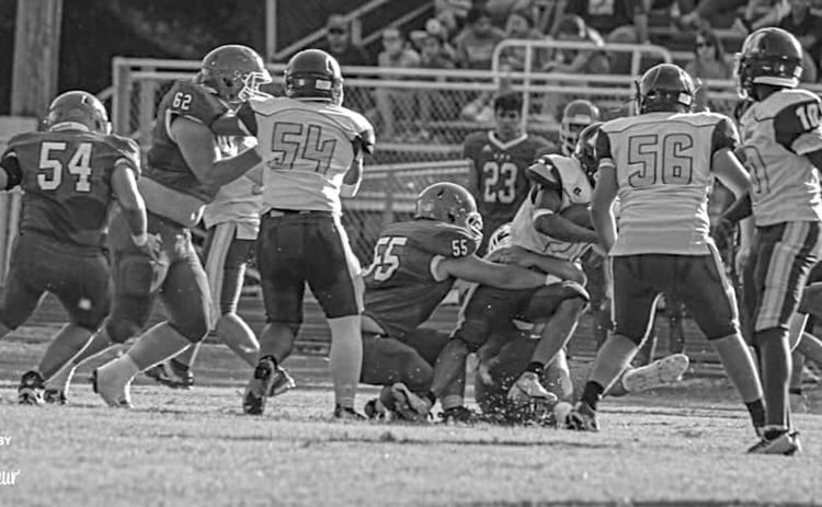 The Bearcat defense is in action earlier this year.  Shown (from left) are Pierre Berzas (54), Scott Berzas (62), and Wyatt Bertrand (55).