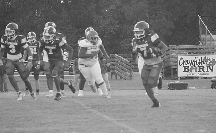 Keontez Campbell (7) scores a 42-yard touchdown against Bolton Academy to begin the regular season. (Gazette photo by Tony Marks)