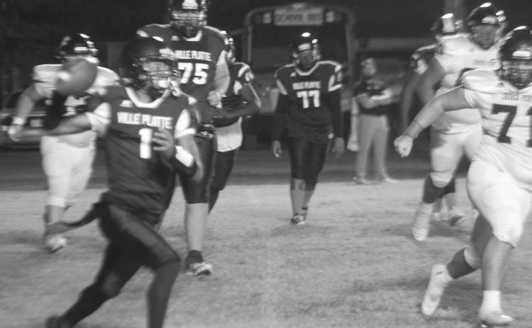 Bulldog quarterback Jaquan Lavergne (1) looks to complete a pass against Church Point on Thursday night. Lavergne and the other seniors were honored during the course of the evening. (Gazette photo by Rhett Manuel)