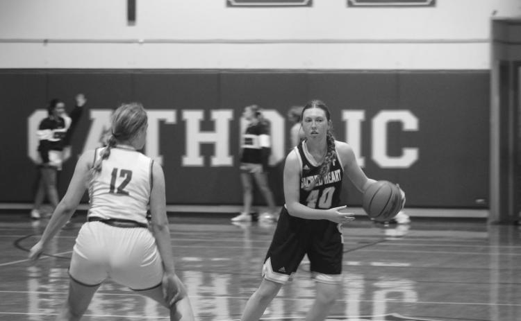 Rose Ardoin (40) moves the ball down the court in Sacred Heart’s 54-43 win over Catholic-Pointe Coupee in the first round of the girls’ basketball playoffs. (Gazette photo by Tony Marks)