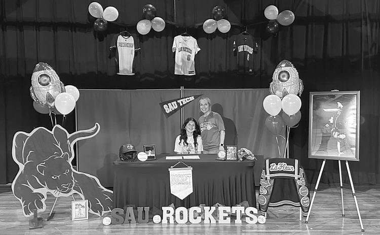 Camron Lafleur is pictured on the left with head Pine Prairie softball coach Alycia Hebert. Lafleur recently signed to play softball with SAU Tech. (Photo courtesy of Pine Prairie High School Softball)