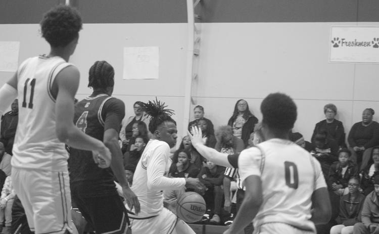 Javion Charles (4) drives through traffic on his way to the basket in Mamou’s 68-48 win over Cecelia.