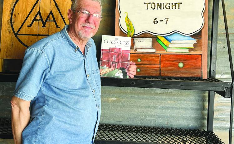 Local author Chris Fontenot poses with a copy of his new book titled “Class of ‘69.” Fontenot will be participating in the Evangeline Parish LIbrary Book Fest on Saturday, May 20, and will have a few copies available for purchase. The event will serve as the official release of his latest book. (Gazette photo by Heather Bogard)