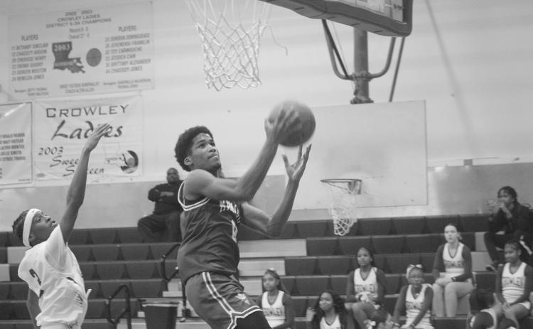 Ernest Dugas (0) goes up for a bucket in Mamou’s 75-54 win over Crowley. The win improved the team’s record to 20-4. (Gazette photo by Tony Marks)