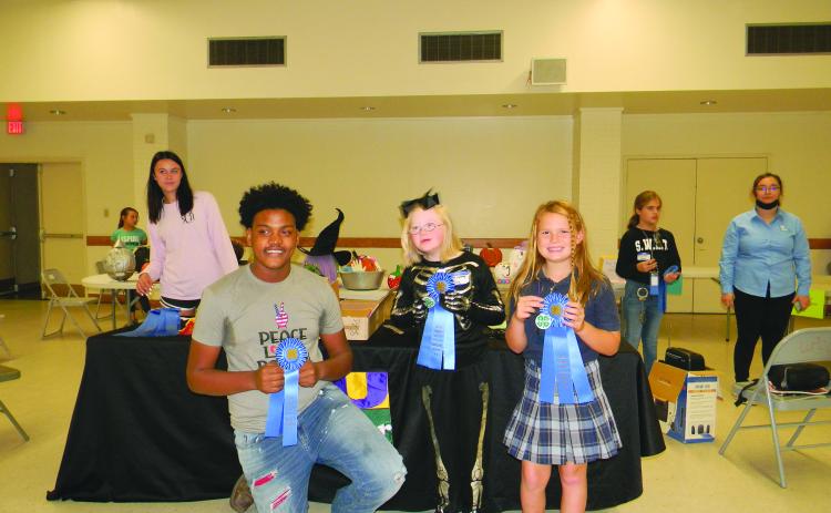 From left, are Jordan Edwards, Aubrey LaHaye and Emy Figueredo, winners in the Rice Cookery divisions.