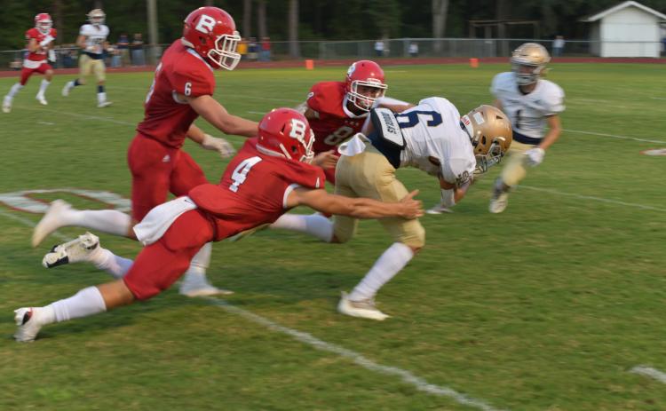 Sacred Heart’s Landon LeBlanc (6) fights for extra yardage after a catch as he jets past Basile’s Luc Johnson (4), Parker Fontenot (6), and Gavin Ardoin (8) in the Trojans’ thrilling win over the Bearcats (Photo courtesy of Tonya Ortego)