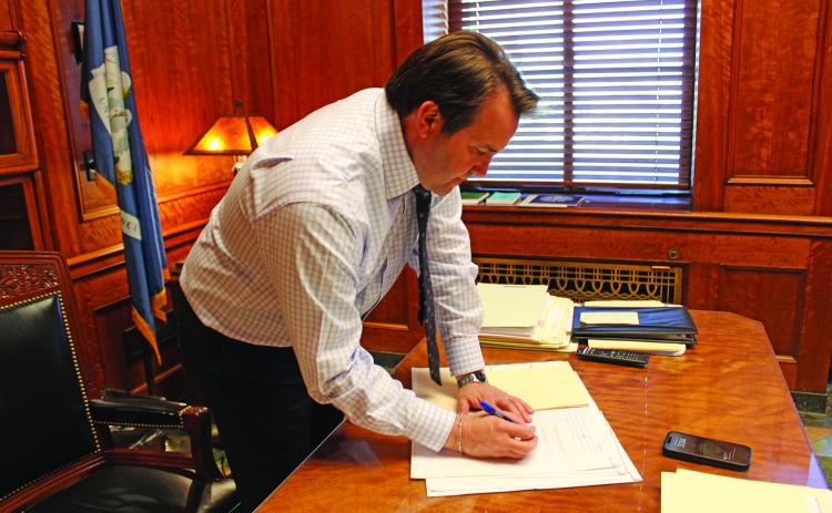 Speaker of the House of Representatives Phillip DeVillier signs bills that were passed in the House on Monday, March 18. The 2024 regular legislative session began Monday, March 11. (LSN photo by Claudette Olivier)