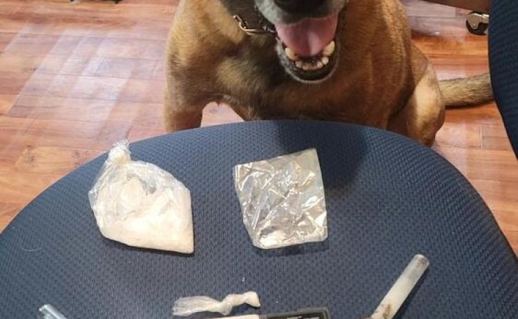 The Evangeline Parish Sheriff’s Department’s K-9 Officer Diego is pictured with items seized following a recent arrest that resulted from a traffic stop on Steven Chad Babineaux, of Eunice. (Photo submitted)