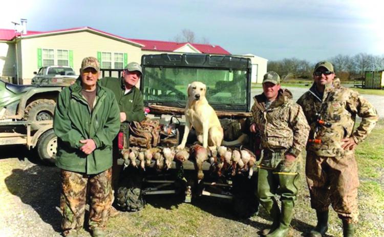 Pictured from left are James C. “Dino” Fontenot, Timmy Sylvester, Dr. Brandon Fontenot, and Mike Poole following a duck hunt years ago. (Photo courtesy of Dr. Brandon Fontenot)