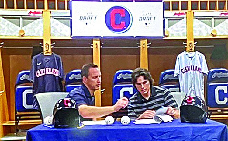 Will Dion, former pitcher for McNeese State University and the son of Ville Platte native Monette Ortego Dion, signs with the Cleveland Indians after being drafted in the ninth round of the 2021 Major League Baseball. He is pictured on the right with Indian Scouting Director Scott Barnsby. (Photo courtesy of Derrick Dion ) 