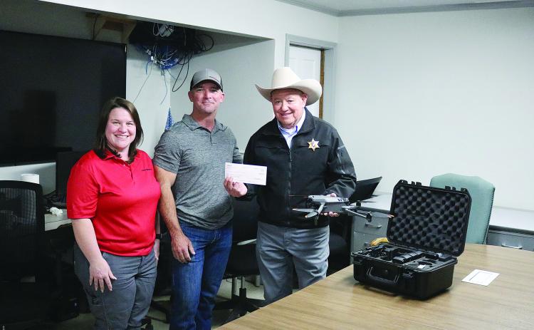 Pictured from left are Molly Smith and Shannon Trahan, both of Kinder Morgan, and Evangeline Parish Sheriff Charles Guillory. (Gazette photo by Tony Marks)