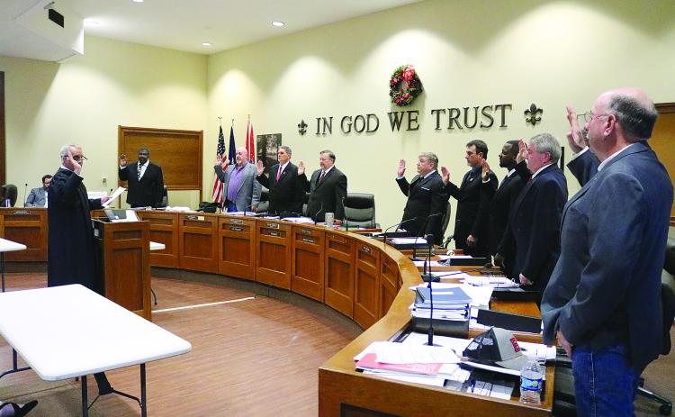 Judge Gary Ortego, of the Third Circuit Court of Appeal, (left) administers the oath of office to the Evangeline Parish Police Jurors. From left are Daniel Arvie, District 9; Keith Saucier, District 1; Kevin Veillon, District 5; Bryan Vidrine, District 7; Tim Causey, District 4; Ryan Ardoin, District 3; Darion Arvie, District 8; Brent Guillory, District 6; and Sidney Fontenot, District 2. (Gazette photo by Tony Marks)