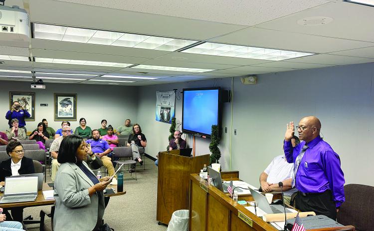 Jerry Bottley (right) takes the oath of office from Assistant District Attorney Betsy Jackson (left). Bottley was elected in October in a special election to fill the unexpired term of Wanda Skinner to represent District 8 of the Evangeline Parish School Board.