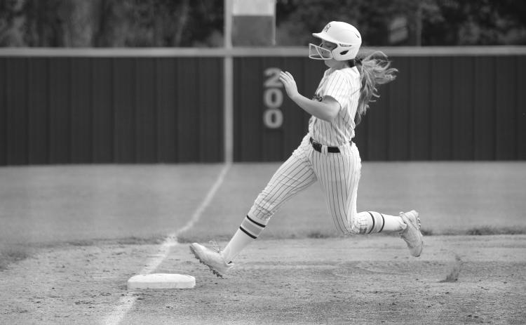 Emily Ardoin (10) steps on the third base bag before heading home for a Sacred Heart run in an 18-0 win over False River Tuesday. (Gazette photo by Tony Marks)