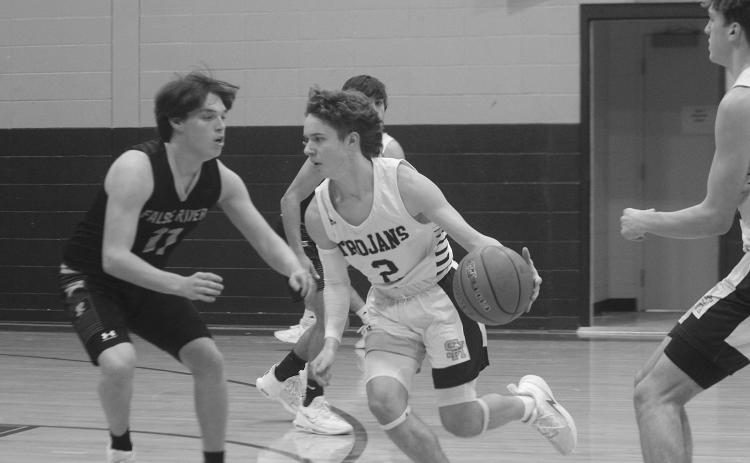 Hayden Deshotel (2) drives toward the net in Sacred Heart’s 73-31 win over False River to begin district play. (Gazette photo by Rhett Manuel)