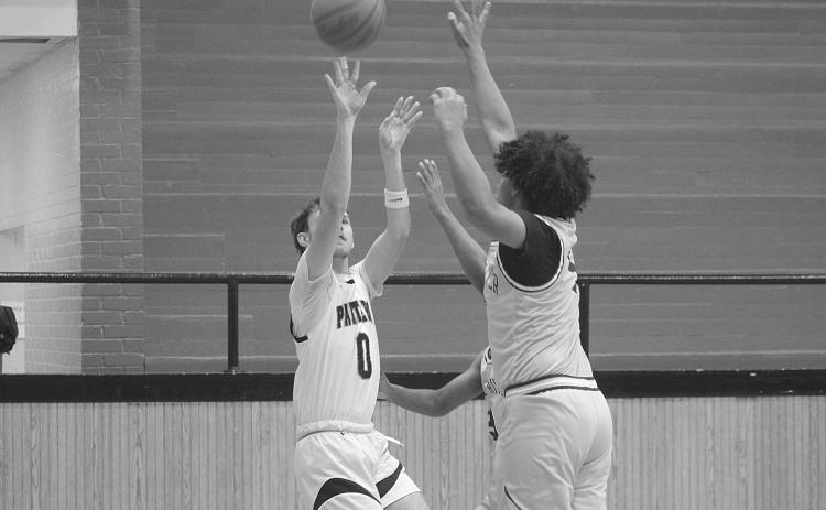 Ashton Deville (0) goes for a basket in Pine Prairie’s 52-37 win over False River. (Gazette photo by Tony Marks)