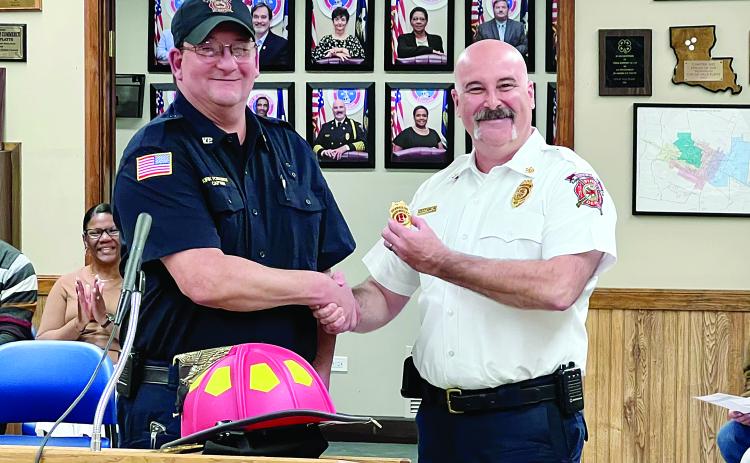 Fire Chief Chris Soileau promoted and pinned Kirk Fontenot as a probationary captain of C Shift. Soileau also presented Fontenot with his new red helmet which indicates line officers. Fontenot has been a full-time operator with the Ville Platte Fire Department since 2010. (Gazette photo by Nancy Duplechain)