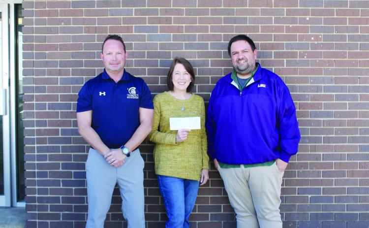 Pictured from left are Lance Chapman, chief financial officer of The Evangeline Bank and Trust Company; Claudia Ortego; and Tony Marks, editor of the Ville Platte Gazette. Not pictured are Garland Forman and Richard Guillory. (Gazette photo by Kathy Longino)