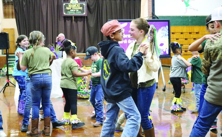 Mamou Elementary French Immersion students dance to a live Cajun band during the school’s French Night on February 8. (Gazette photo by Tony Marks)