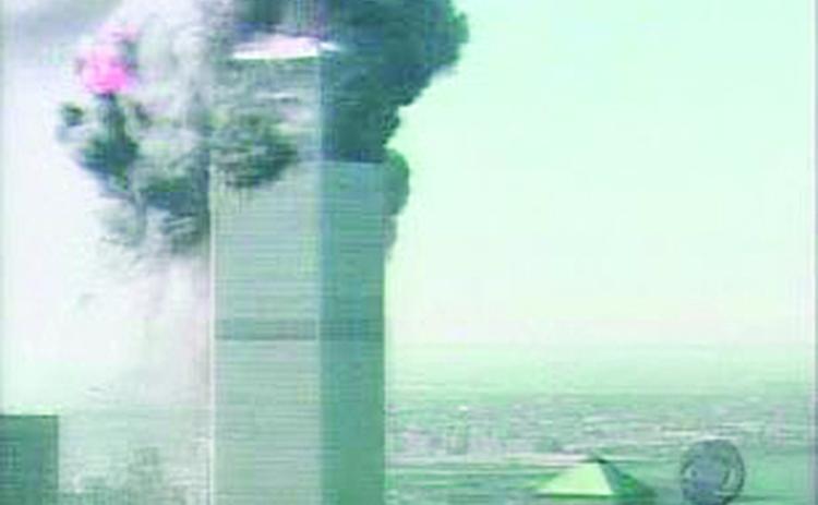 A fiery scene of the World Trade Center building on Tuesday, September 11, 2001, before it collapsed. (Bottom left photo) A view of the Pentagon as flames rolled across the skyline.