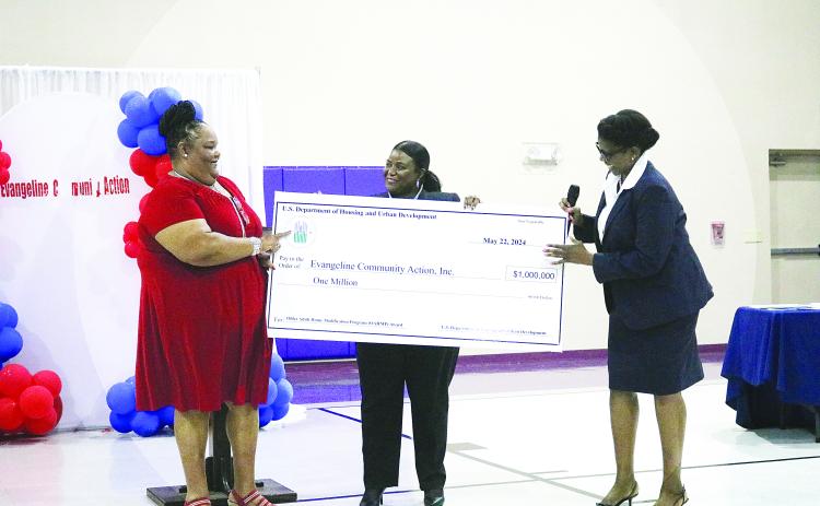 Executive Director of Evangeline Community Action Agency , Inc., Carleen Bellard (left) accepts a $1 million grant from HUD Office of Lead and Hazard Control and Healthy Homes Dr. Taneka Blue, and HUD New Orleans field office director Sylvia Purvis (right). (Gazette photo by Tony Marks)