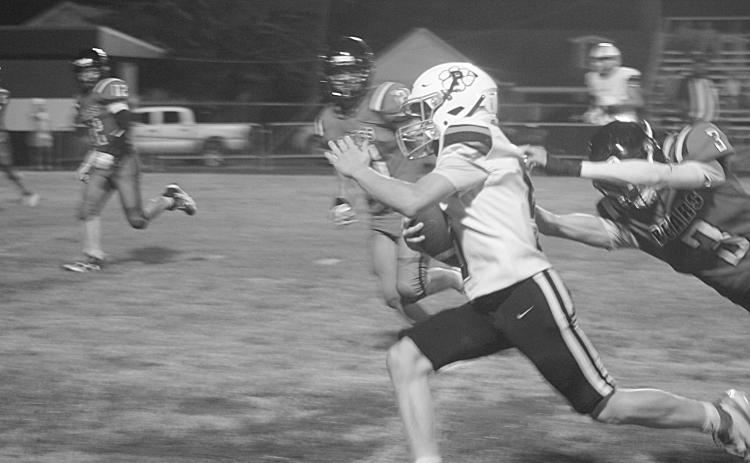 Jacob Carroll (5) breaks a would be tackle for a big gain in Pine Prairie’s 50-42 loss to Gueydan. (Gazette photo by Tony Marks)