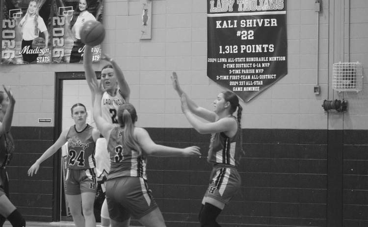 Bre Ardoin (24) looks to pass the ball to a Sacred Heart teammate in a 42-41 loss to Hackberry on Tuesday night. (Gazette photo by Tony Marks)