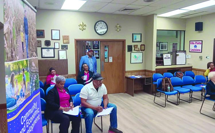 Participants, including Ville Platte Mayor Ryan LeDay Williams (center), listen to a presentation during a recent heirs’ property training event in Ville Platte. (Photo provided by the Southern University Ag Center)