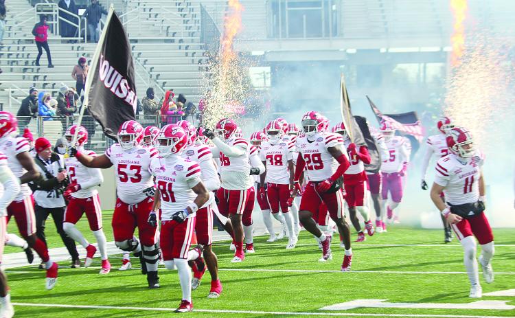 The Ragin Cajuns of the University of Louisiana Lafayette take the field in Shreveport before clashing against the University of Houston Cougars in a 23-16 loss in the Radiance Technologies Independence Bowl. (LSN photo by Tony Marks)
