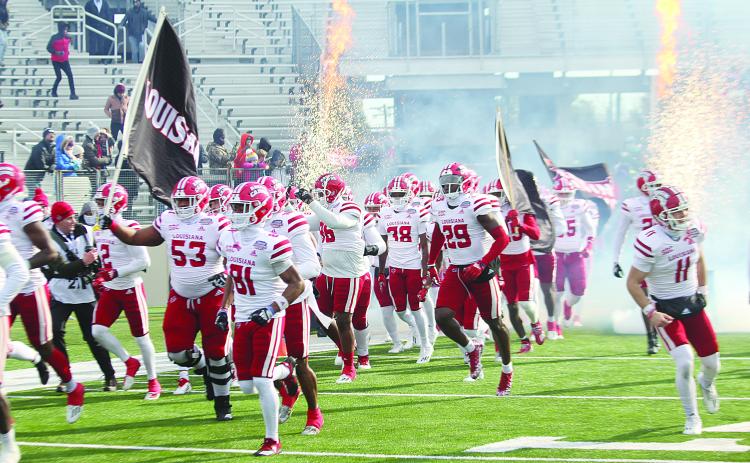 The Ragin Cajuns of the University of Louisiana Lafayette take the field in Shreveport before clashing against the University of Houston Cougars in a 23-16 loss in the Radiance Technologies Independence Bowl. (LSN photo by Tony Marks)