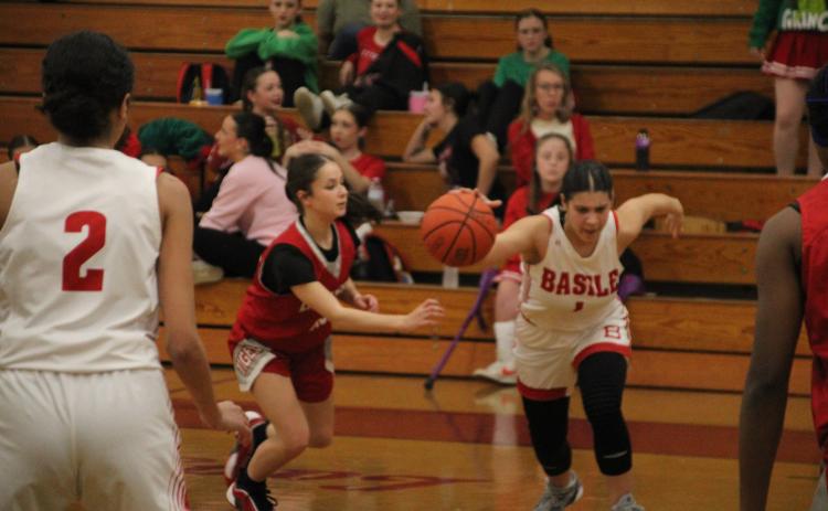 Kiyah Brown is pictured as she dribbles the ball down the court in Basile’s 50-31 win over DeQuincy at home on Tuesday night. (LSN photo by Rhett Manuel)