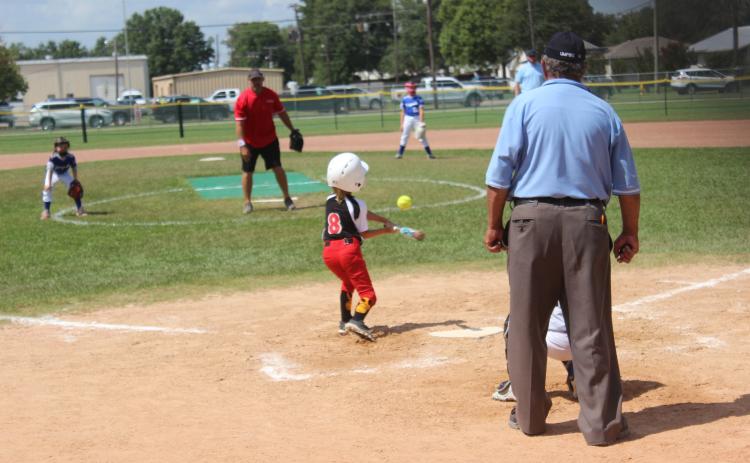 Ville Platte Red Hots player Leah Stevens puts the bat on the ball during Saturday’s Pony Coach Pitch Sectional tournament in Kaplan. The Red Hots won their opening game against Youngsville. (Gazette photo by Rhett Manuel)