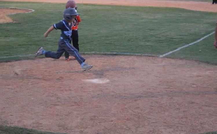 Graham Fontenot (4) scores a run for the Ville Platte West All-Stars against Pine Prairie North. (Gazette photo by Rhett Manuel)