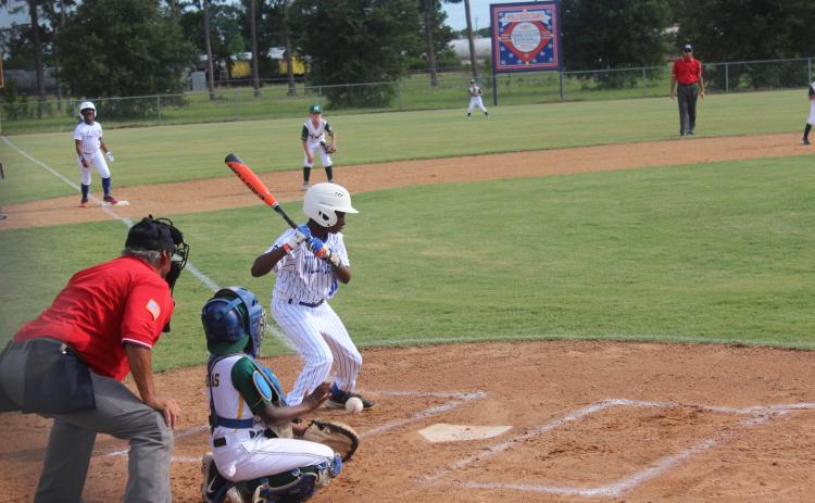 With Deion Jones (2) standing 60 feet away on third base, I’Jai Lewis (30) watches a pitch cross home plate for a ball. Jones and Lewis are members of the Super 10 All-Stars from Ville Platte that took home the District 7 championship. (Gazette photo by Rhett Manuel)