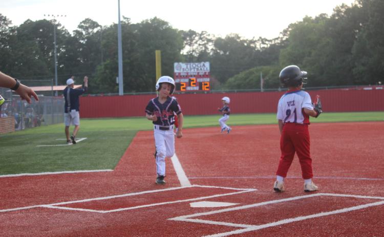 Ville Platte East t-ball All-Star Levi Welch glides into home plate in a state tournament game over the weekend. Ville Platte East managed a 5-2 record in Tioga, qualifying the team to play in the upcoming World Series. (Gazette photo by Rhett Manuel)